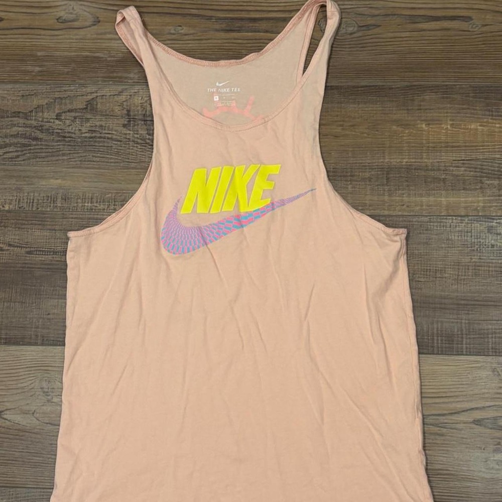 Nike spellout tank top with yellow Nike logo and blue/pink swoosh